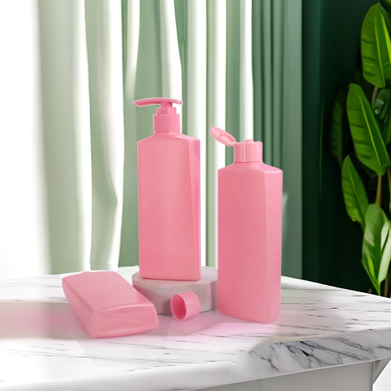 Pink rectangular cosmetic bottles displayed on a marble counter, demonstrating the kind of bold brand colour that has to be matched to a Pantone reference under Delta E tolerance