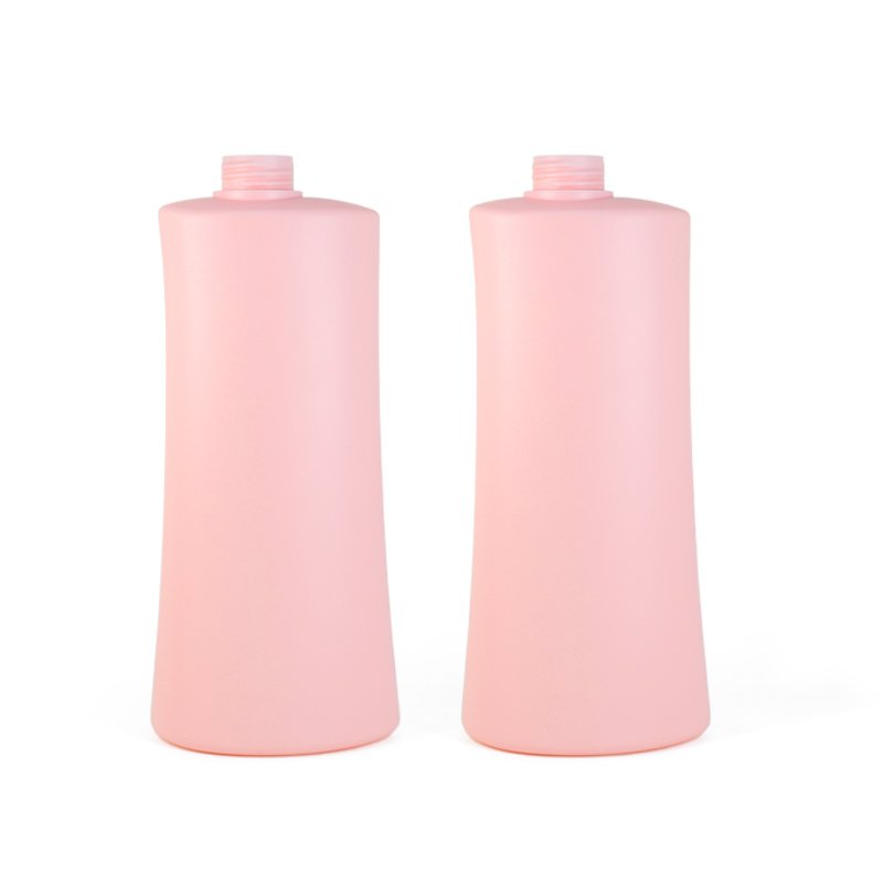 A 1000ml pink HDPE cosmetic bottle photographed against a neutral background, representative of the PET, HDPE and PETG bottles where bio-based and plant-derived resins are increasingly specified